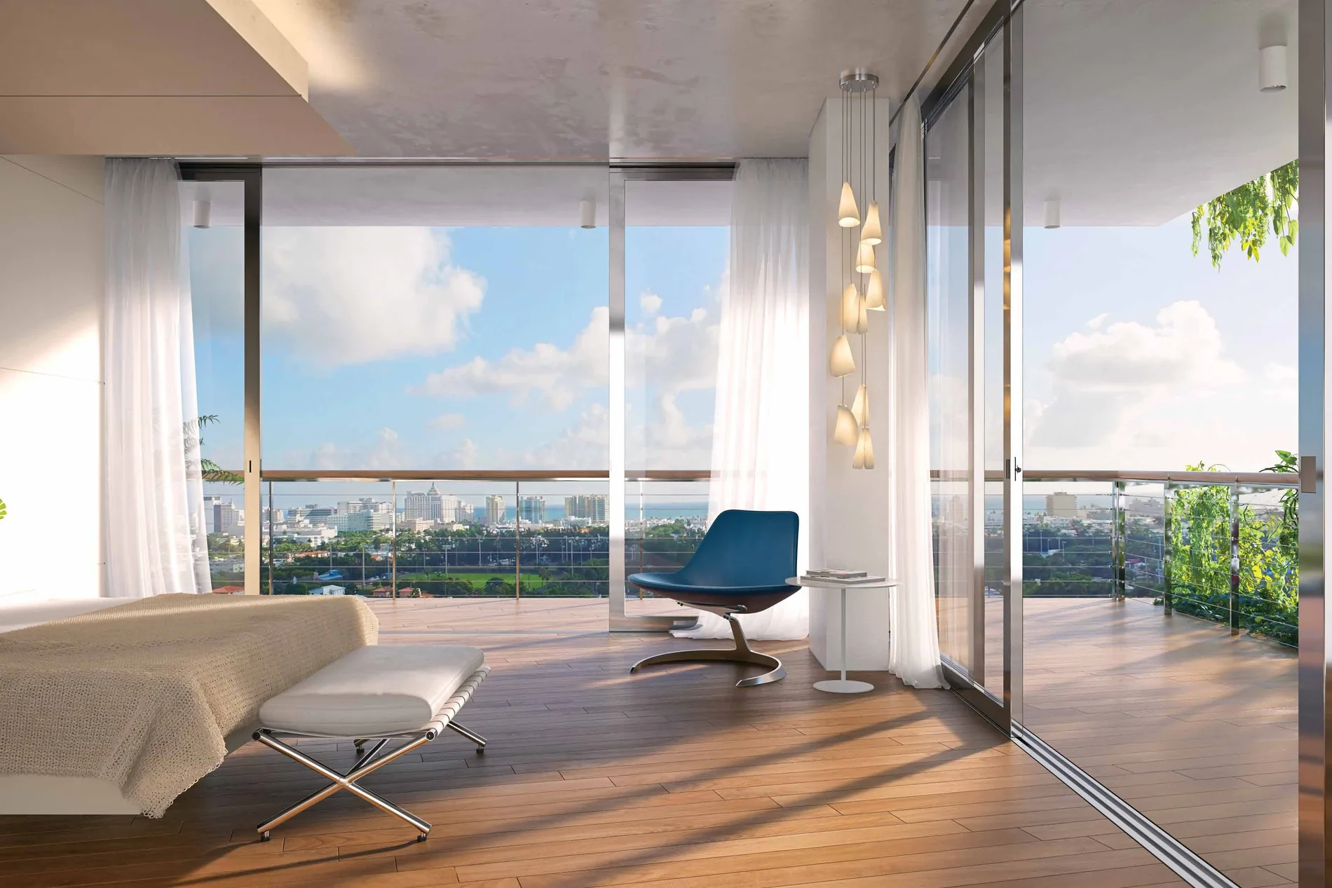 A bedroom with full-height sliding glass onto a planted terrace, looking east across South Beach to the ocean