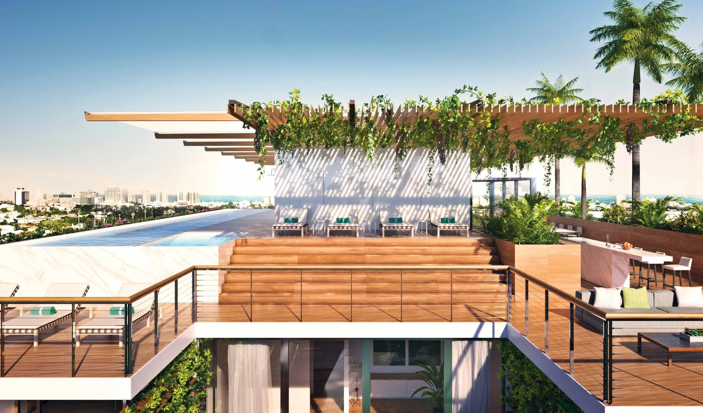 The roof deck at midday, a pool and planted pergola above the rooftops of South Beach