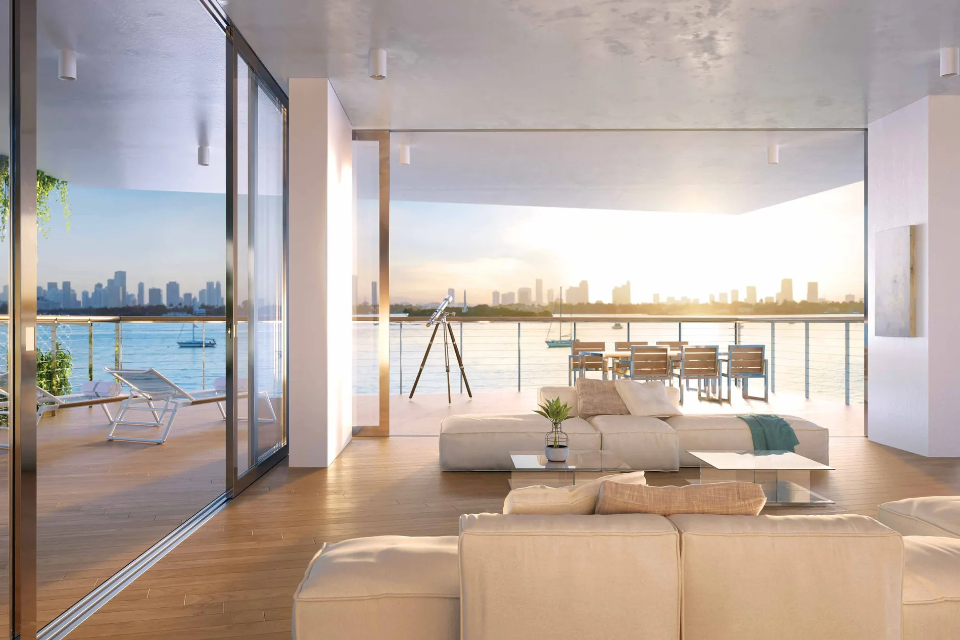 A living room opening onto its terrace, a telescope and dining table set against the bay and the Miami skyline