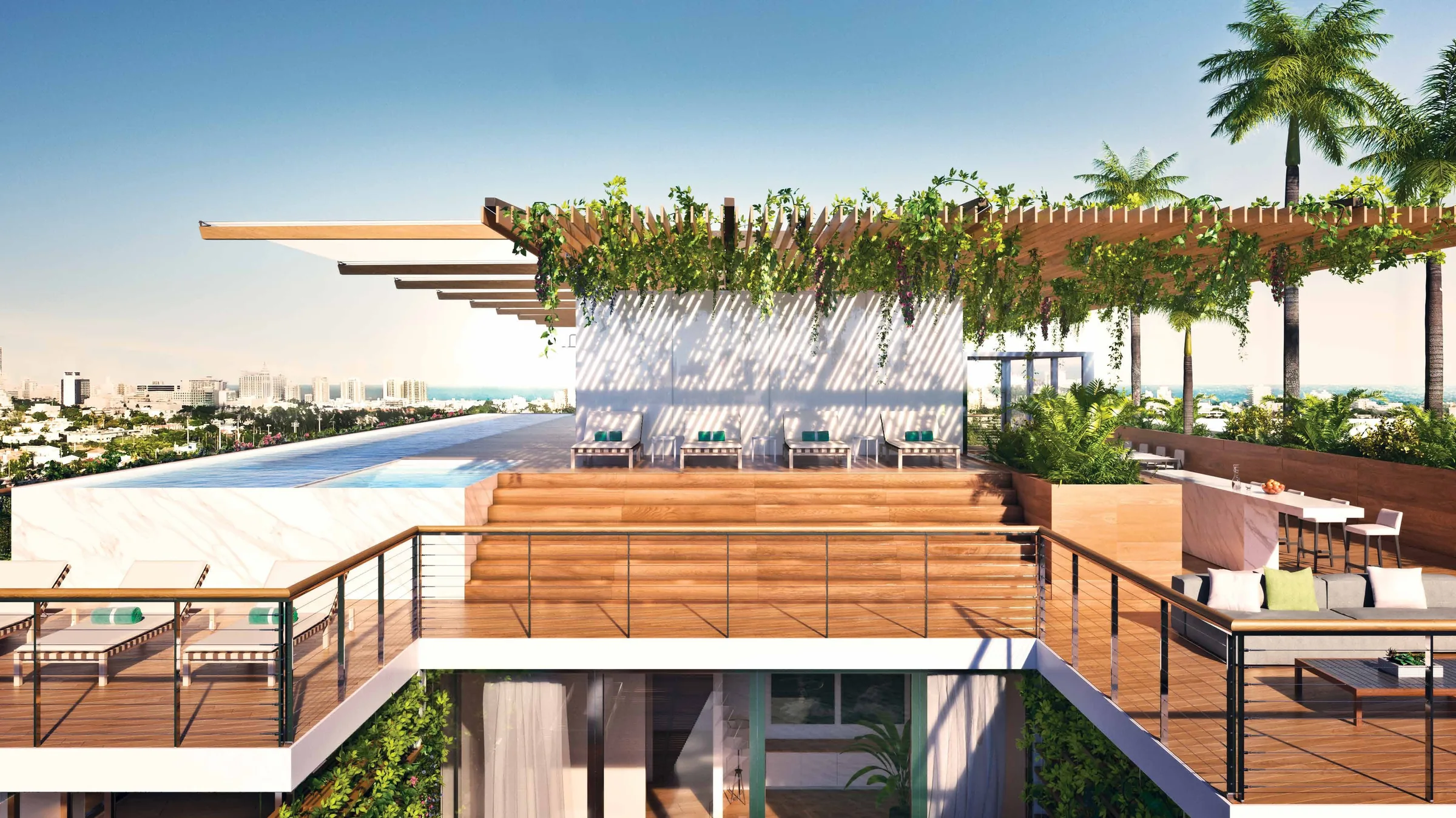 A roof deck with a pool, a planted timber pergola and a bar counter above the rooftops of South Beach